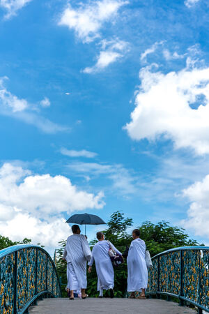 Three nuns on bridge