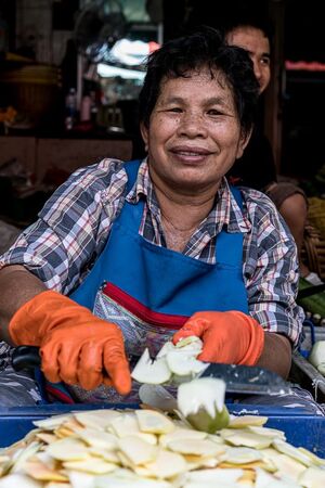 Woman cutting fruits