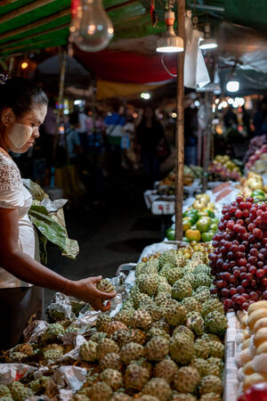 Fruit store at a night market in Yangon