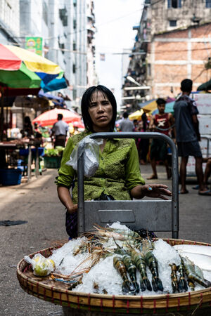 Woman selling shrimps