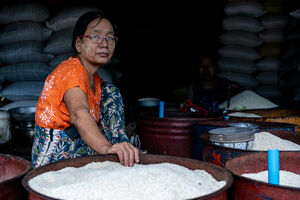 Woman and bowls filled with rice