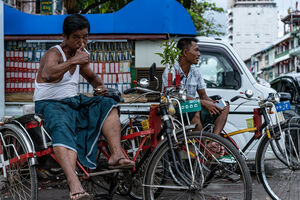 Powerful thumbs-up of rickshaw man