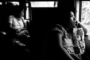 Woman sleeping comfortably on car