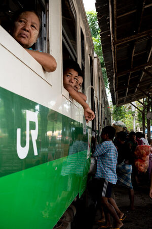 Passengers leaning out of car windows
