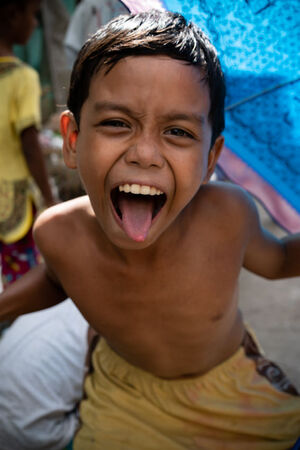 Boy sticking out his tongue