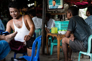 Men relaxing in eating place