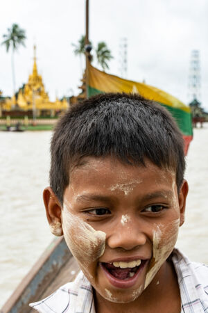 Boy working on boat to Ye Le Pagoda