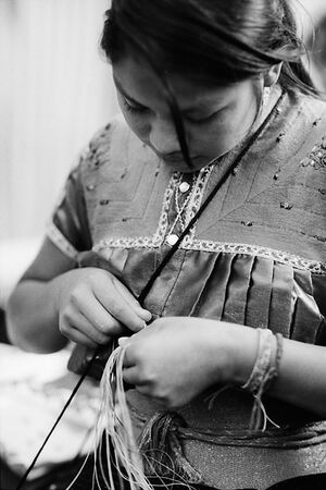 Young woman stitching