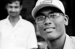 Young man wearing glasses and cap