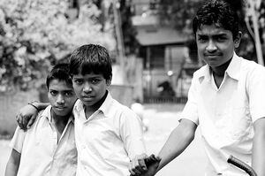 Three boys in street