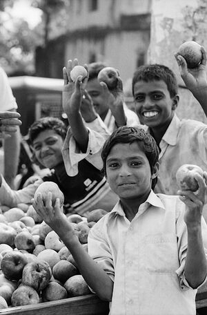 Men holding apples