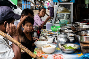 People having a meal in food stall