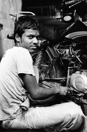 Man repairing motorbike