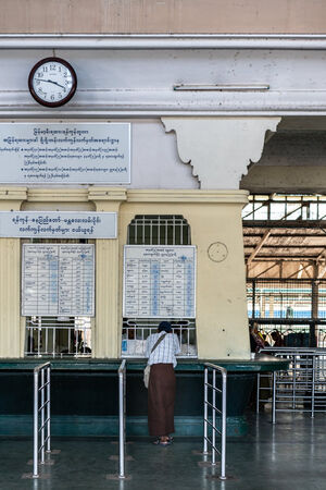 Man buying at ticket booth in Yangon Central Station
