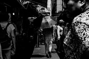 Umbrella among shoppers in Bailan Market