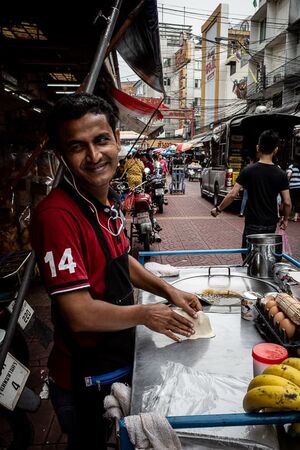 Street vendor getting shy