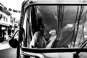 Bajaj parked by the roadside in Glodok, Jakarta