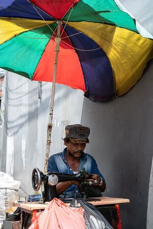 Sewing machine under a parasol parasol