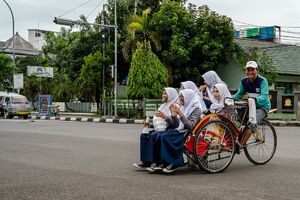 Becak with five schoolgirls