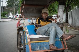 Elderly Becak driver