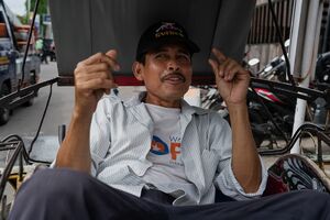 Becak driver with mustache