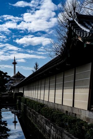 Kyoto Tower reflected in the moat