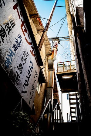 Signboard, stairs and blue sky