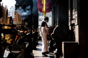Couple paying their respects at the Guan Yu Temple in Yokohama