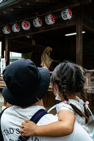 Parent and child watching Kagura Performance