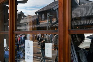 Old townscape of Kawagoe reflected in the glass door