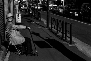 Old man sitting on chair