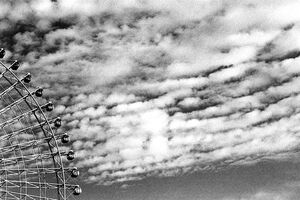 Ferris wheel under clouds