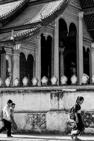 kids walking in front of temple