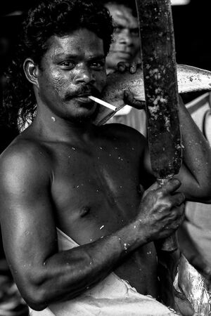 Man striking pose while smoking