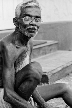 Old man working shirtless