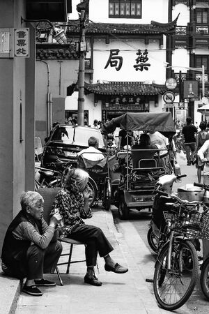 Two older women relaxing by the wayside
