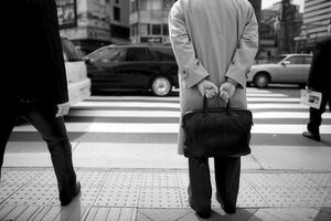 Business man carrying black bag
