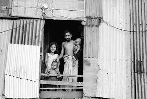 Family standing by window