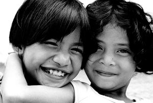 Two girls smiling happily