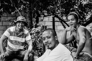 Young men hanging out by roadside