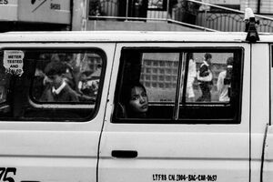 Woman looking out through car window