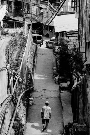 Man walking backstreet