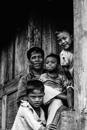 Man and boys in mountain village