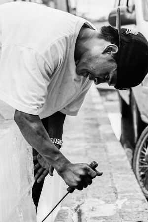 Ice seller breaking ice