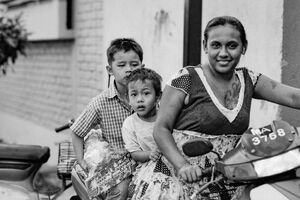 Mother and two sons riding on same motorbike