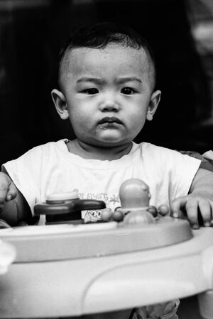 Baby wearing grumpy look
