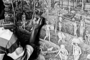 Painter drawing the country view on the canvas