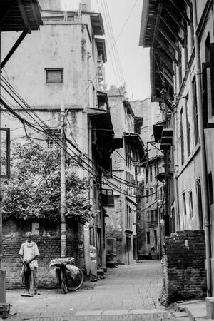 Mango seller standing in street corner