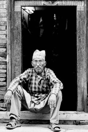 Old man sitting with doing nothing