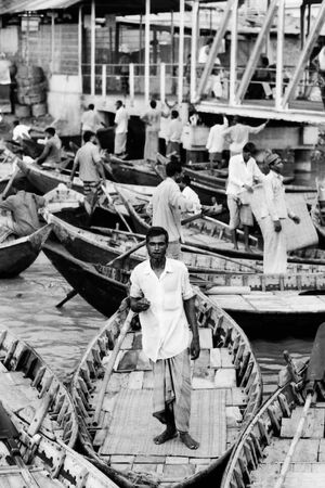 Man standing on the rowboat